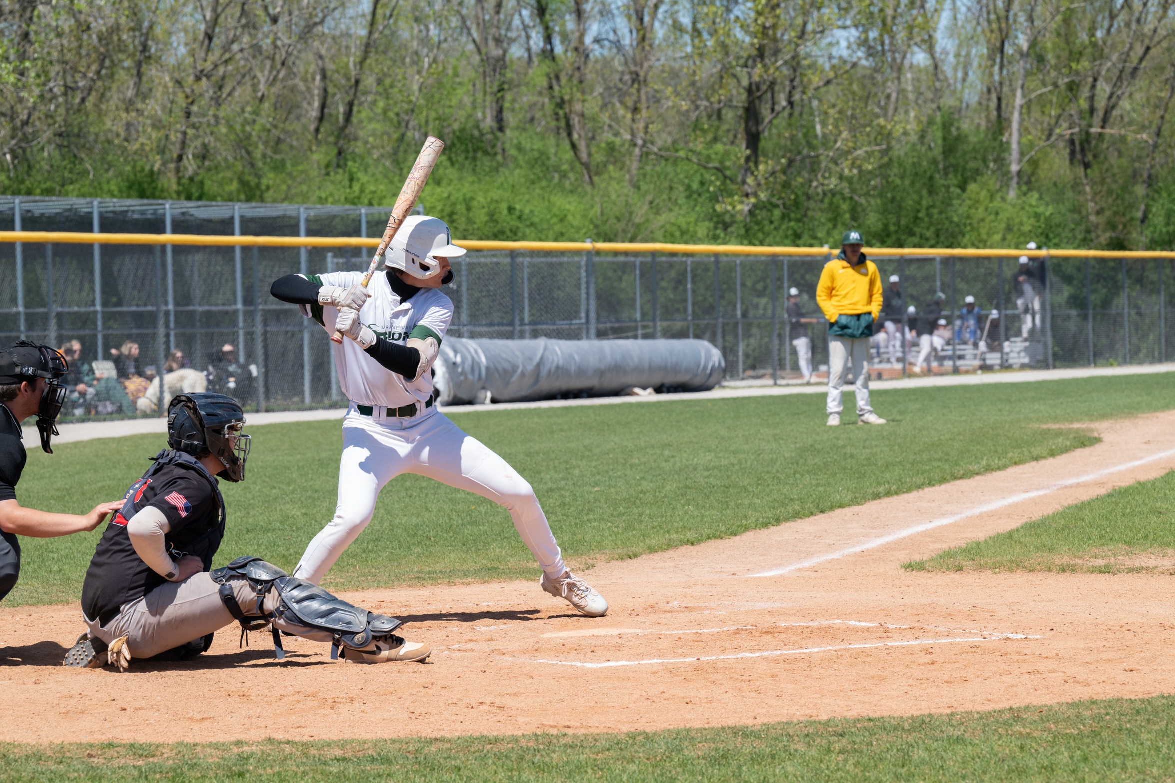 A Moraine Valley baseball player is ready to swing the bat at the plate.