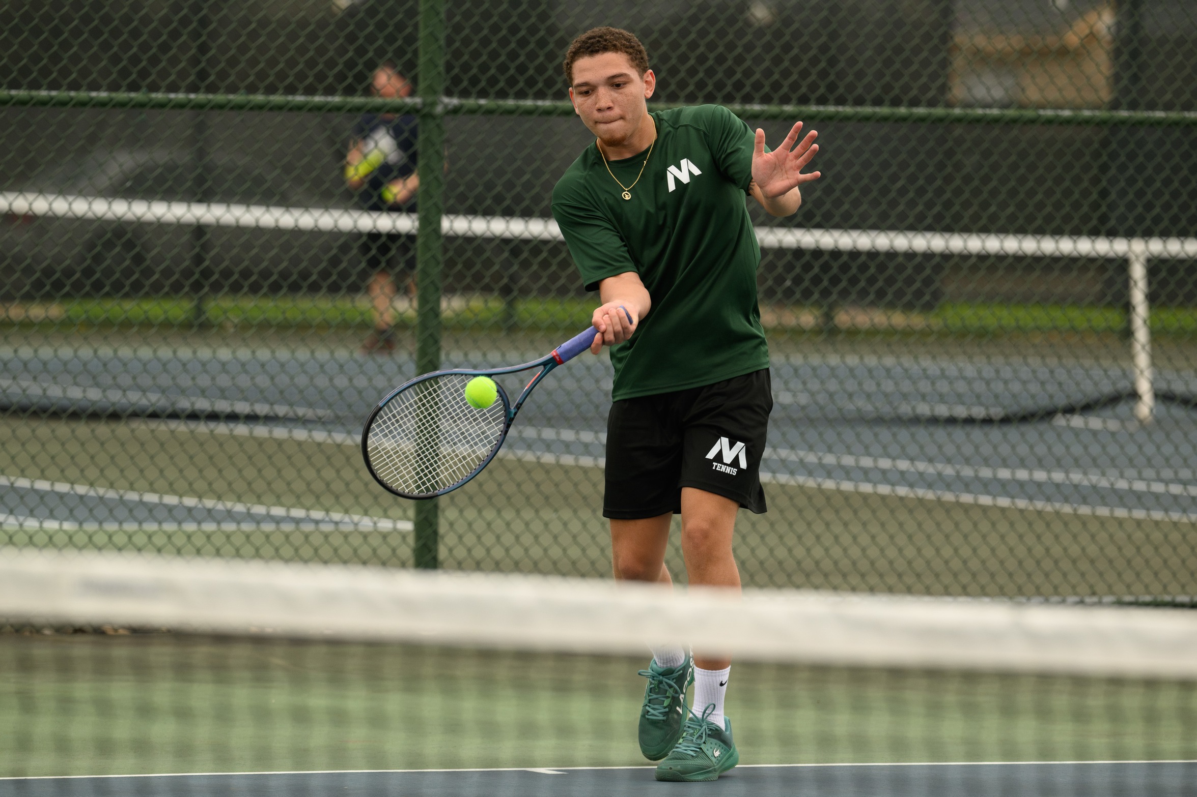 A Moraine Valley tennis player hits the ball.